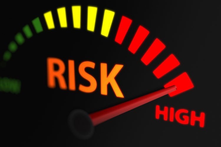 Graphic of a risk indicator with an arrow pointing to red - idea of high risk