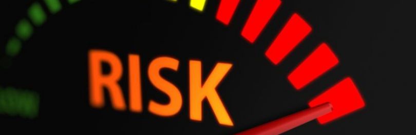 Graphic of a risk indicator with an arrow pointing to red - idea of high risk
