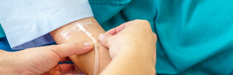 Patient receiving treatment via intravenous infusion