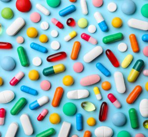 Range of coloured pills with excipients