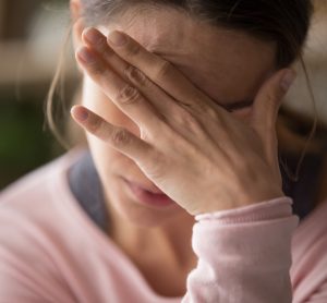 Close-up of woman having a migraine