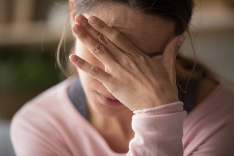 Close-up of woman having a migraine