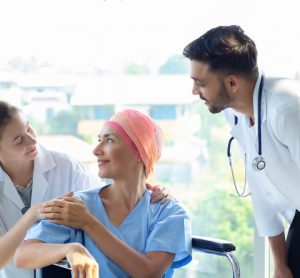 Cancer patient with nurse and doctor