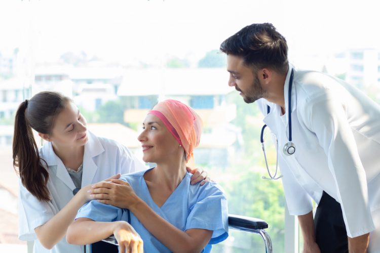 Cancer patient with nurse and doctor