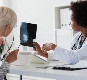 Doctor showing breast screening