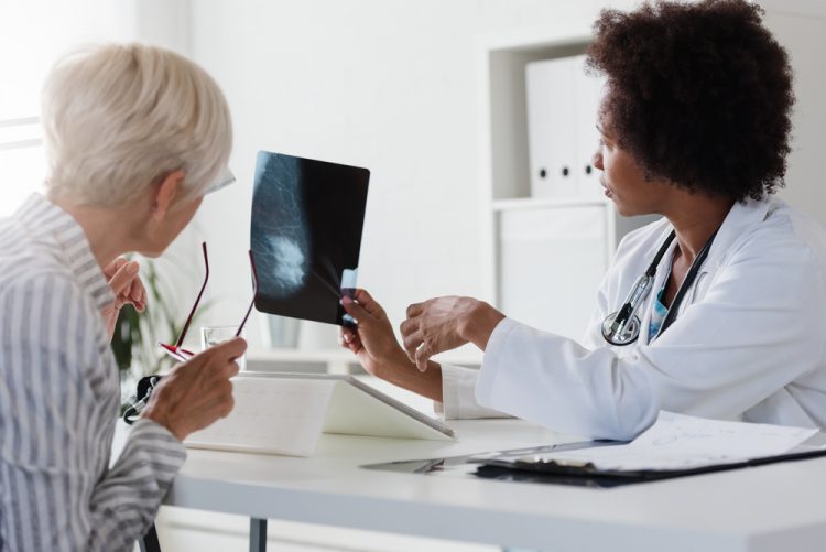 Doctor showing breast screening