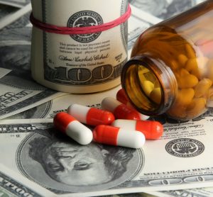 Pills and bottle split on dollars