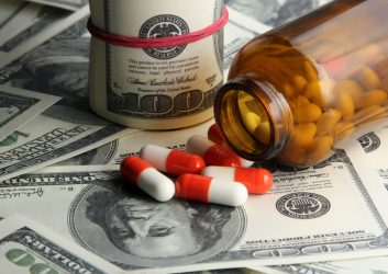 Pills and bottle split on dollars