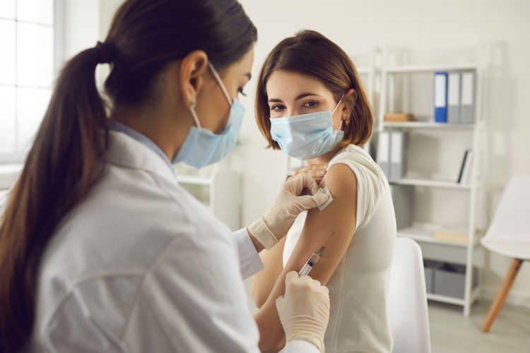 Woman receiving vaccine