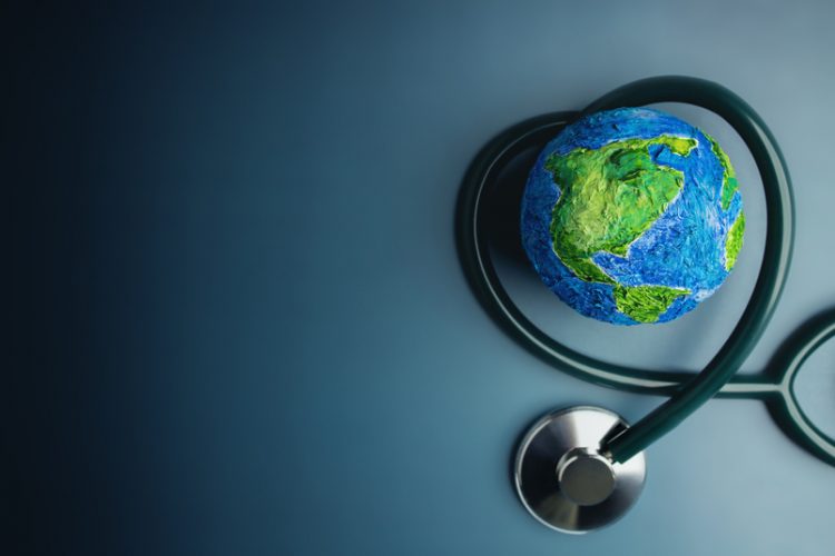 Miniature of Earth with stethoscope wrapped around
