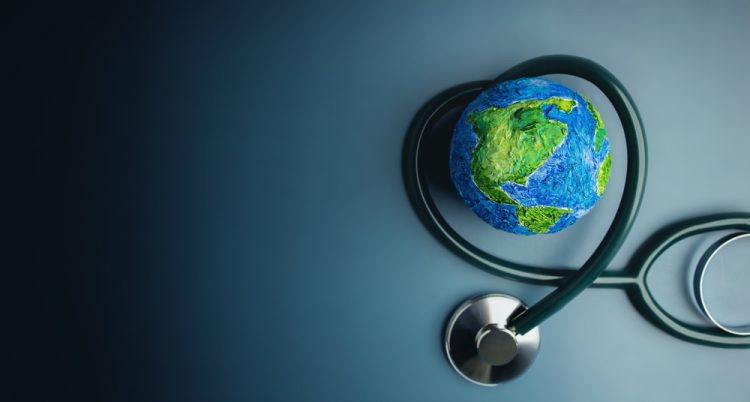 Miniature of Earth with stethoscope wrapped around