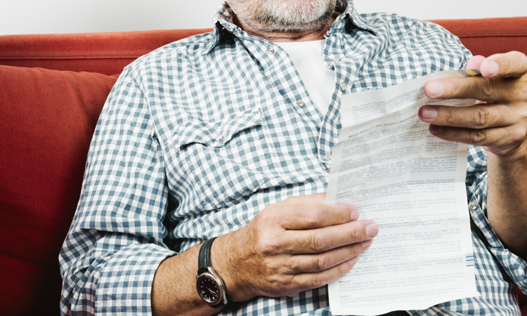 Man with patient information leaflet