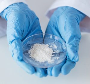 White powder held by scientist