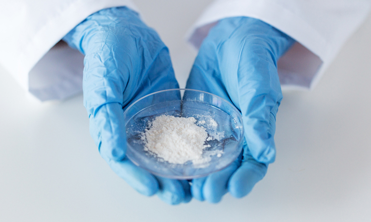 White powder held by scientist