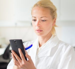 Scientist on mobile phone - COVID-19 app