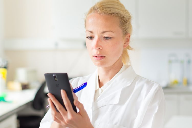 Scientist on mobile phone - COVID-19 app