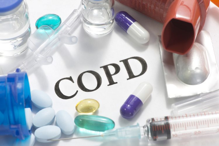 Paper with COPD written on it and surrounded by medicines