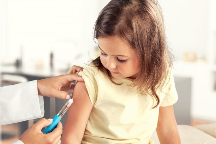 Child receiving vaccine