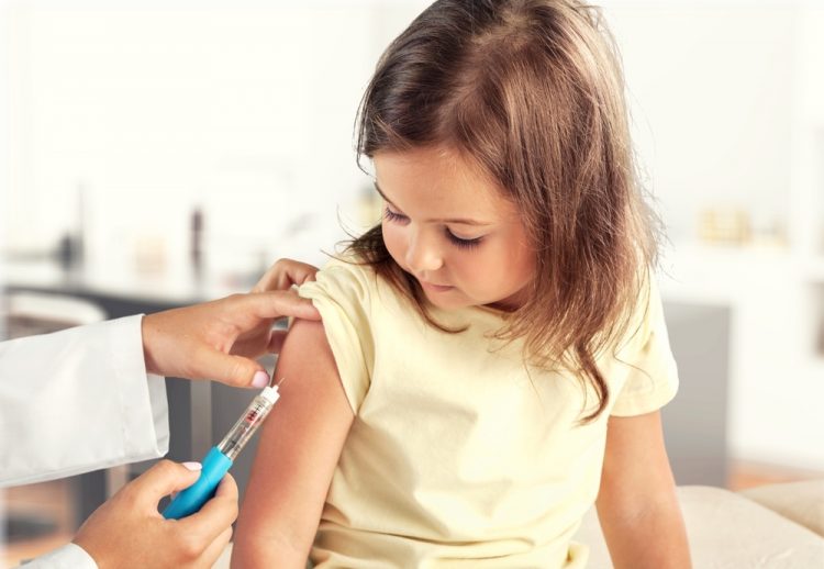 Child receiving vaccine