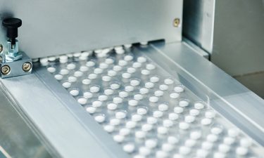 Pills on a conveyor belt