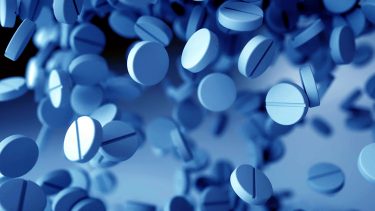 Pills on blue background