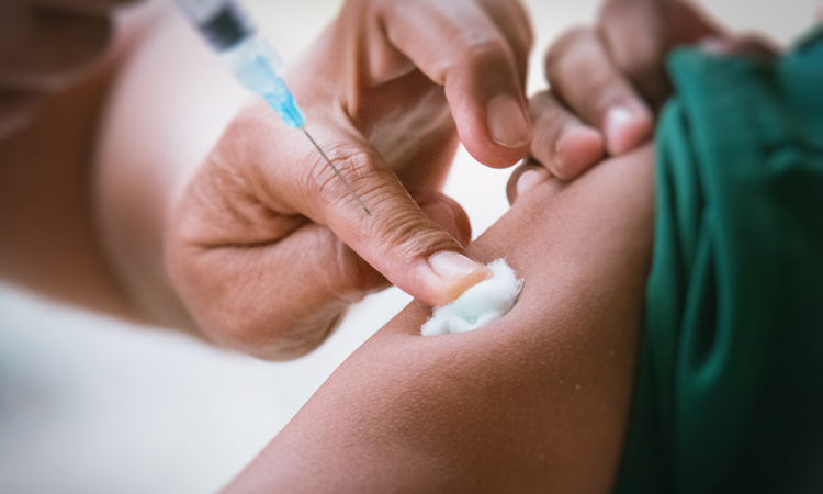 Vaccine being delivered closeup