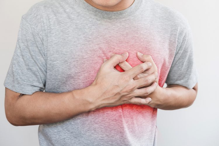 Man clutching heart, implying heart failure