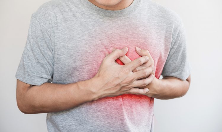 Man clutching heart, implying heart failure