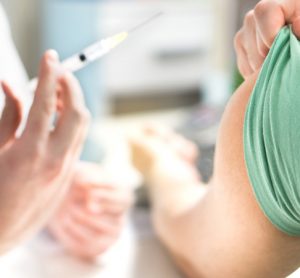 Vaccine being administered to patient