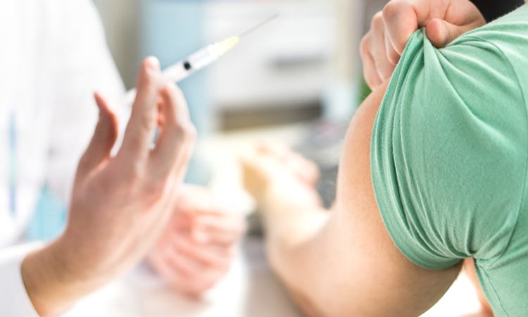 Vaccine being administered to patient