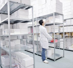 Worker in medicine warehouse