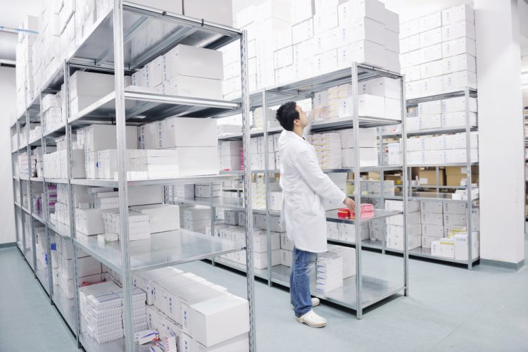 Worker in medicine warehouse