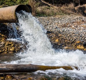 wastewater pipe releasing water into a stream